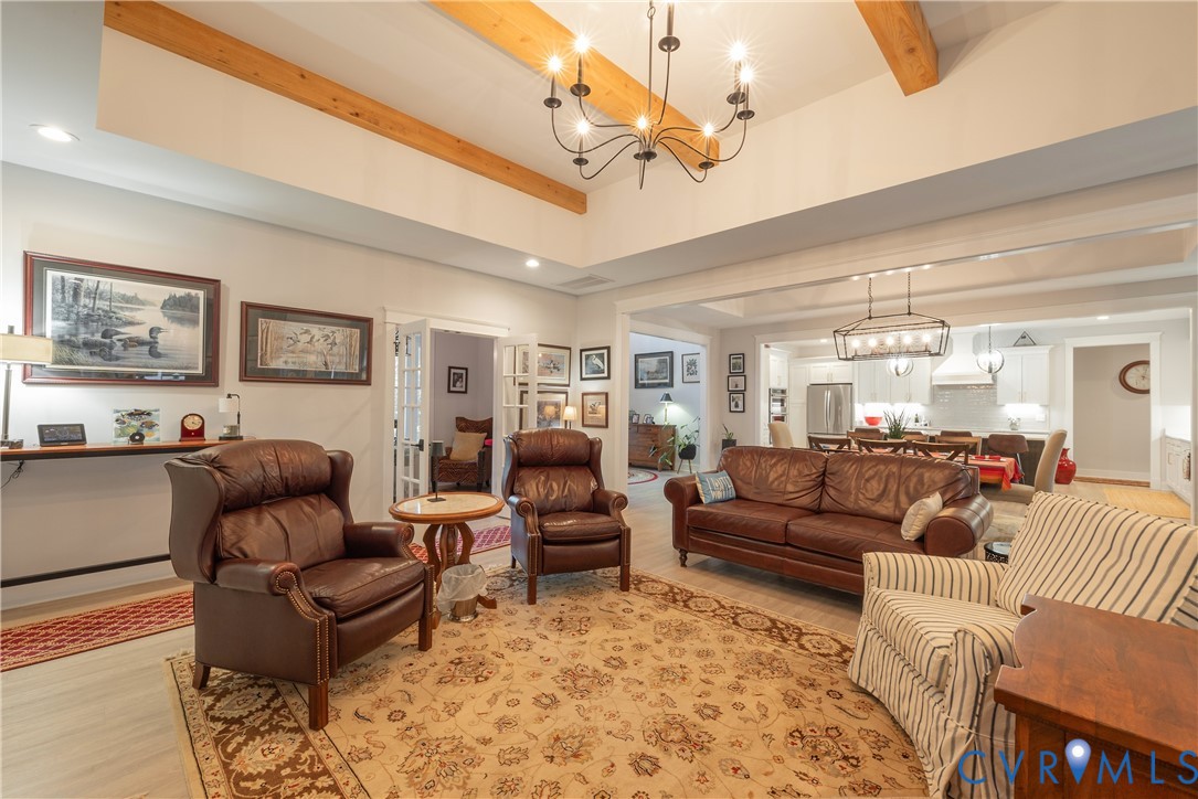 2591 Shaughnessy Road Powhatan, VA 23139 - Photo 32 of 50 a living room with furniture ceiling fan and a rug