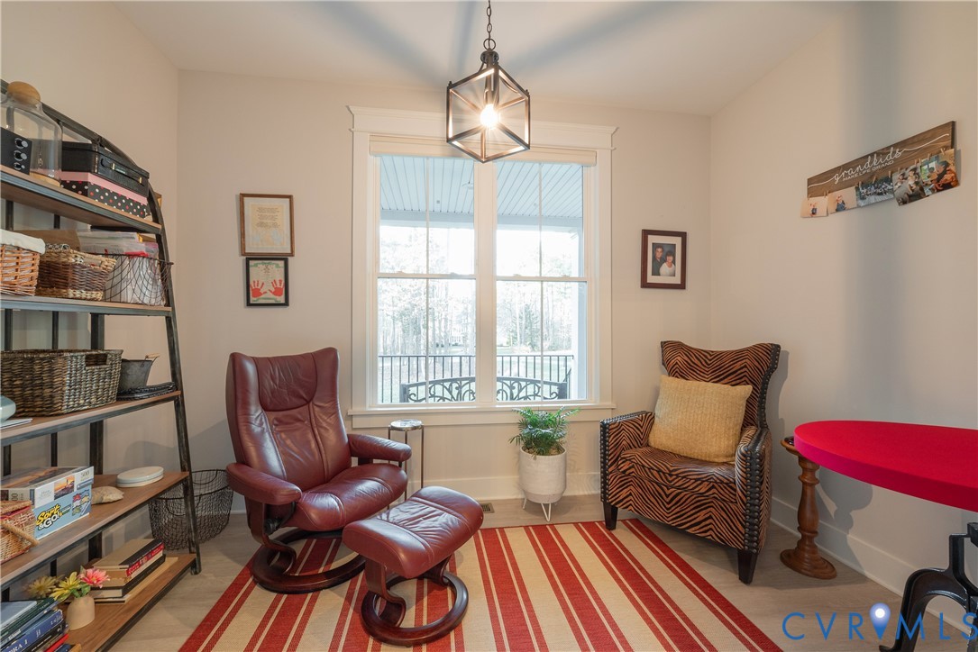 2591 Shaughnessy Road Powhatan, VA 23139 - Photo 34 of 50 a living room with furniture a rug and a window