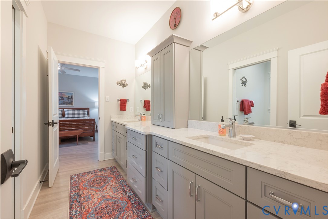2591 Shaughnessy Road Powhatan, VA 23139 - Photo 41 of 50 a en suite bathroom with a sink and a mirror