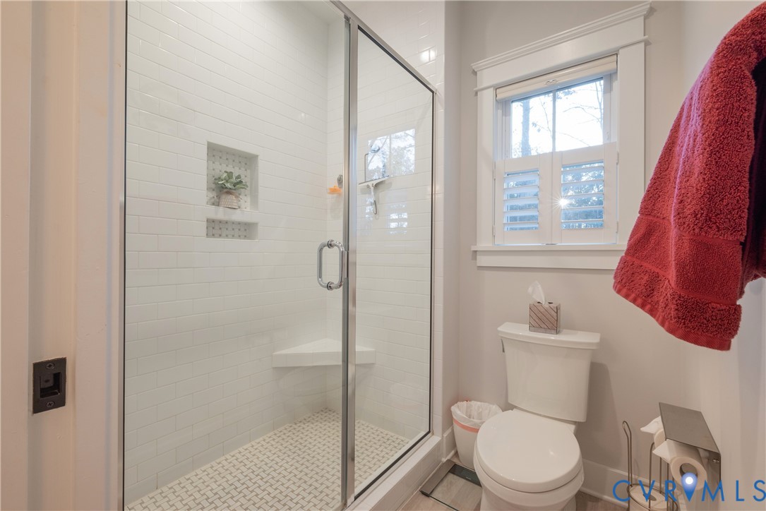 2591 Shaughnessy Road Powhatan, VA 23139 - Photo 42 of 50 a white toilet sitting next to a bathroom sink