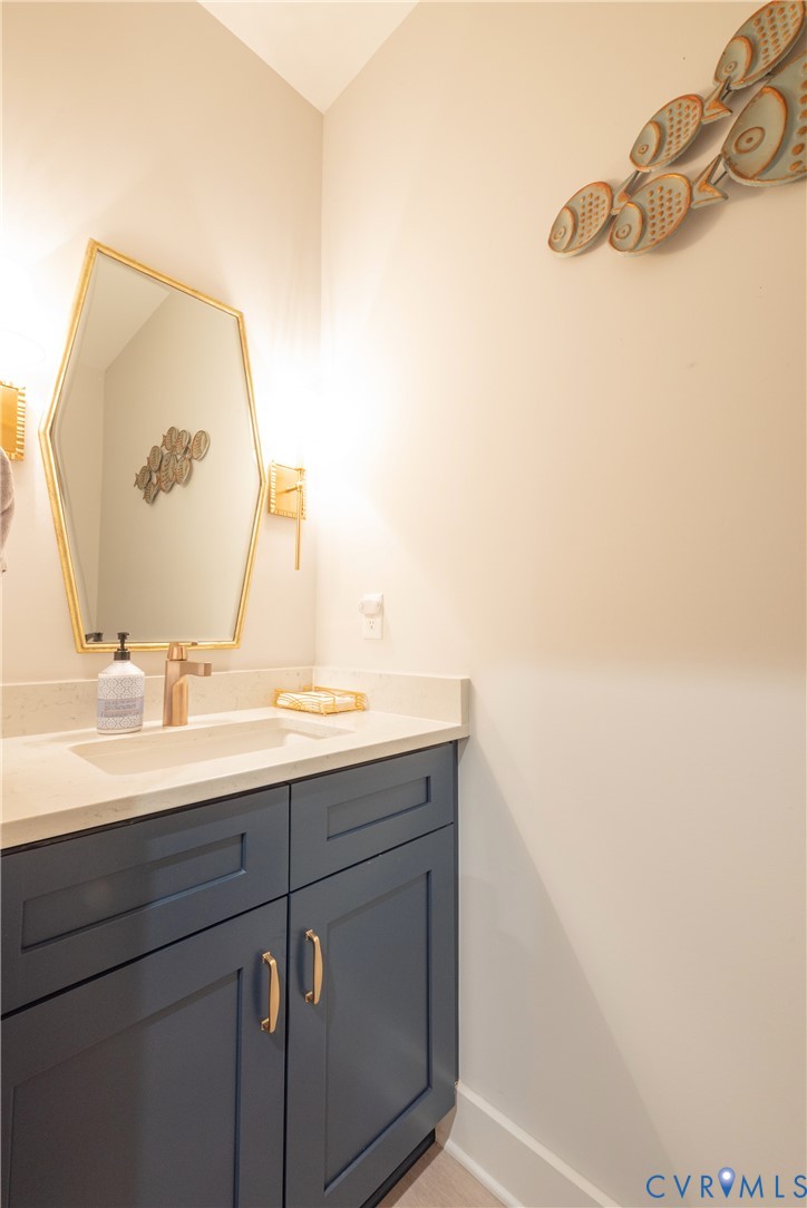 2591 Shaughnessy Road Powhatan, VA 23139 - Photo 45 of 50 a bathroom with a sink and a mirror