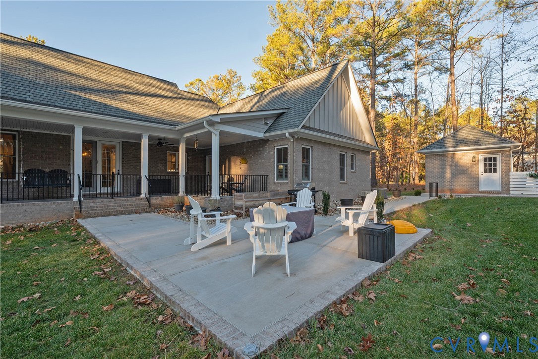2591 Shaughnessy Road Powhatan, VA 23139 - Photo 7 of 50 a view of a house with backyard sitting area and garden