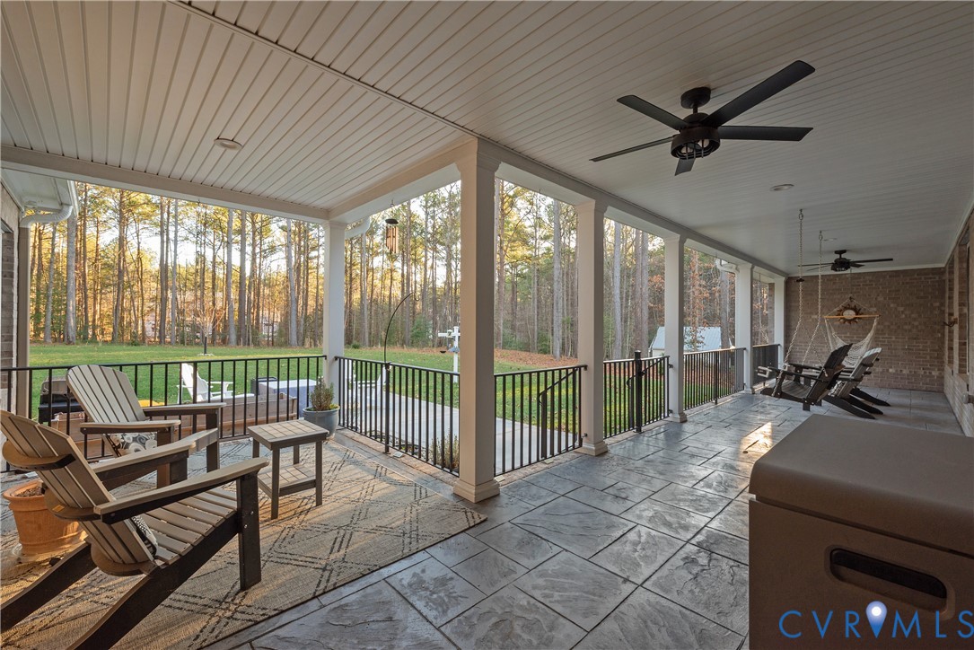 2591 Shaughnessy Road Powhatan, VA 23139 - Photo 10 of 50 a living room with furniture and a floor to ceiling window