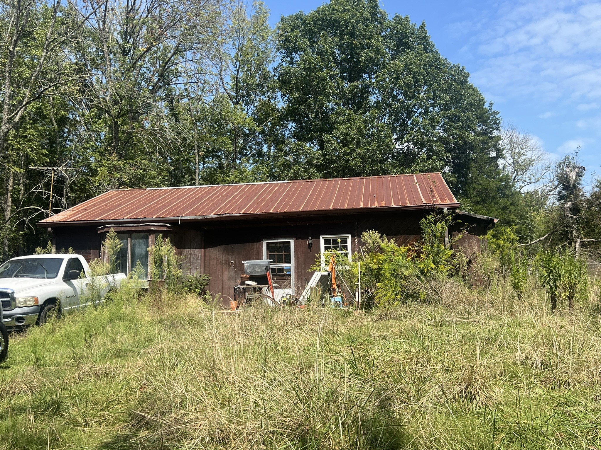 910 Campsite Road Castalian Springs, TN 37031 - Photo 8 of 11 a front view of a house with garden