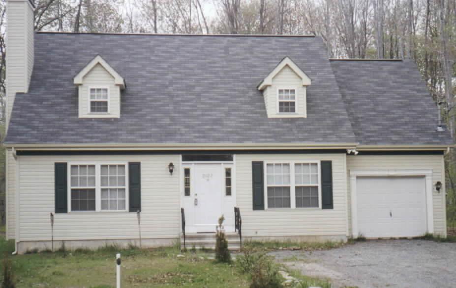 2002 Romeo Road Tobyhanna, PA 18466 - Photo 1 of 1 a front view of a house with a yard