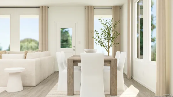 a bathroom with a sink and mirror with bathtub