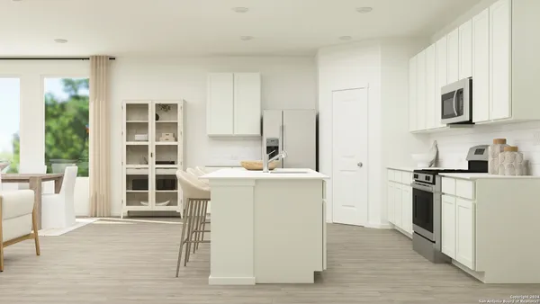a kitchen with a sink cabinets and stainless steel appliances