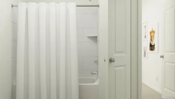a bathroom with a shower curtain