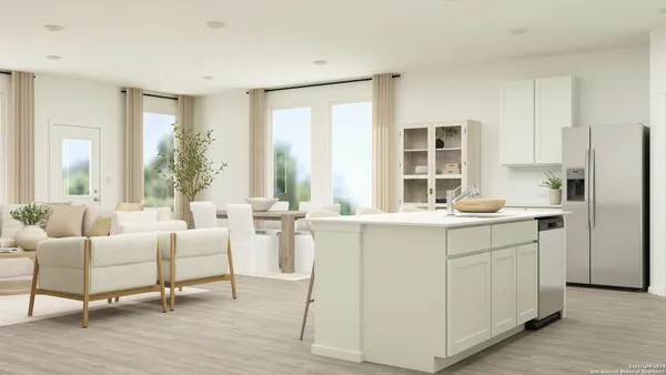 a living room with furniture and large windows