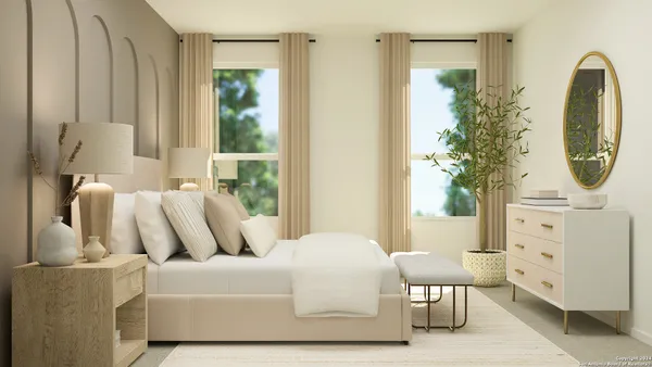 a bedroom with a bed a mirror and a window