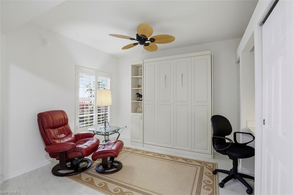 23820 San Marino Road, Unit 102 Estero, FL 34135 - Photo 22 of 28 Home office with ceiling fan and light tile patterned floors