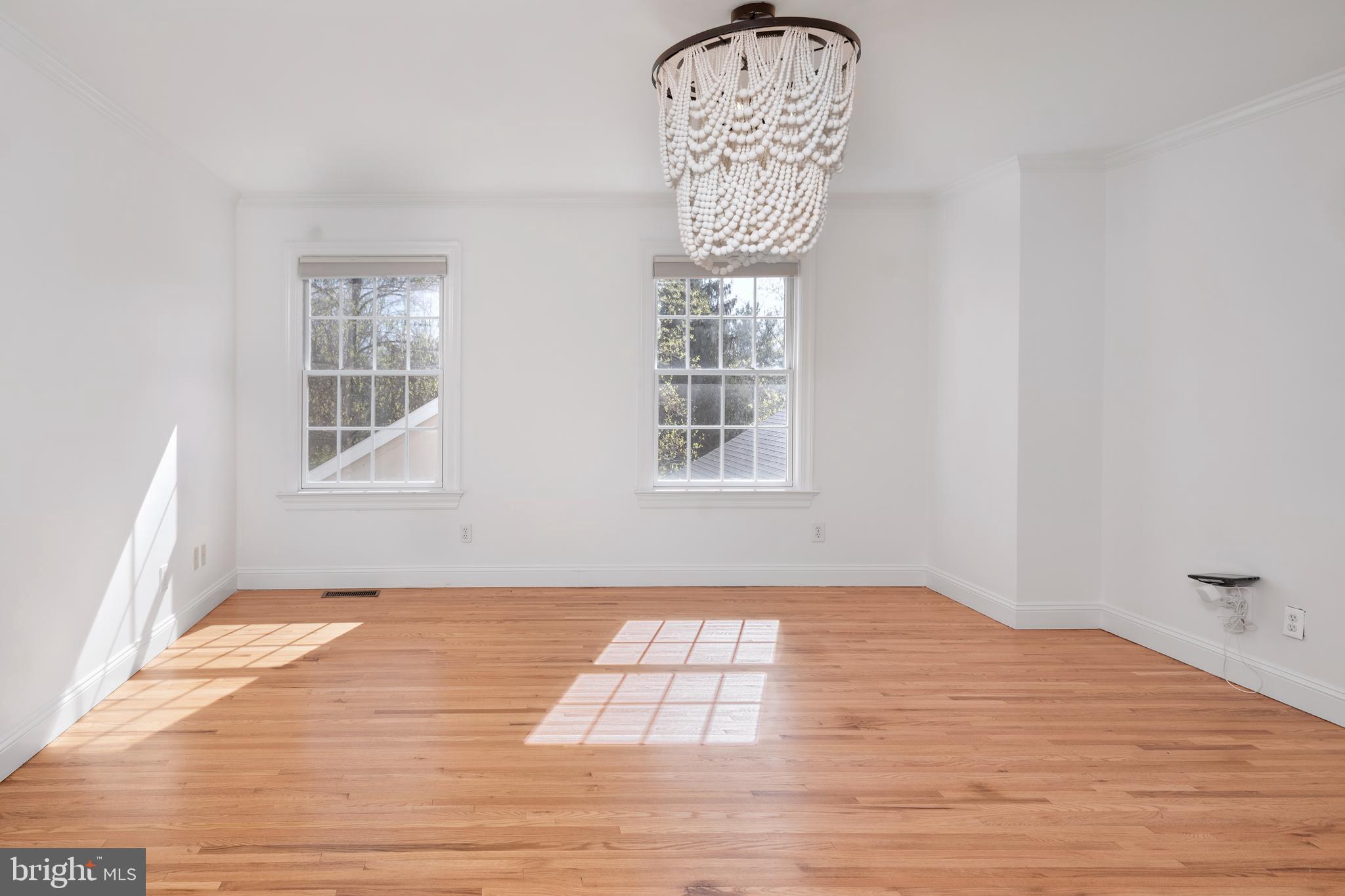3 Governors Lane Princeton, NJ 08540 - Photo 11 of 26 a view of empty room with wooden floor and fan