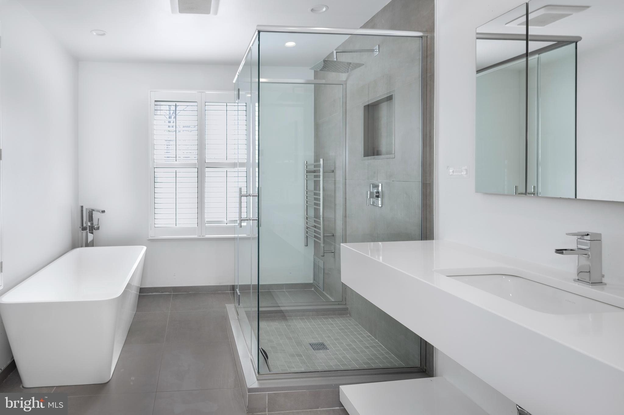 3 Governors Lane Princeton, NJ 08540 - Photo 13 of 26 a bathroom with a tub a sink and a shower