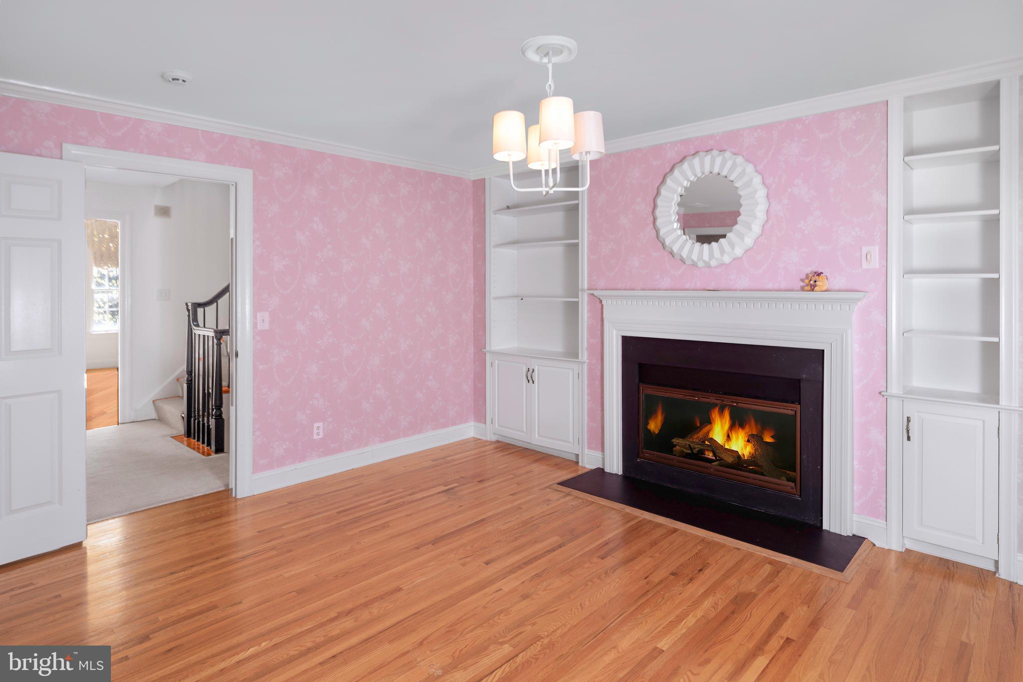 3 Governors Lane Princeton, NJ 08540 - Photo 15 of 26 a view of an empty room with a fireplace wooden floor and a fireplace