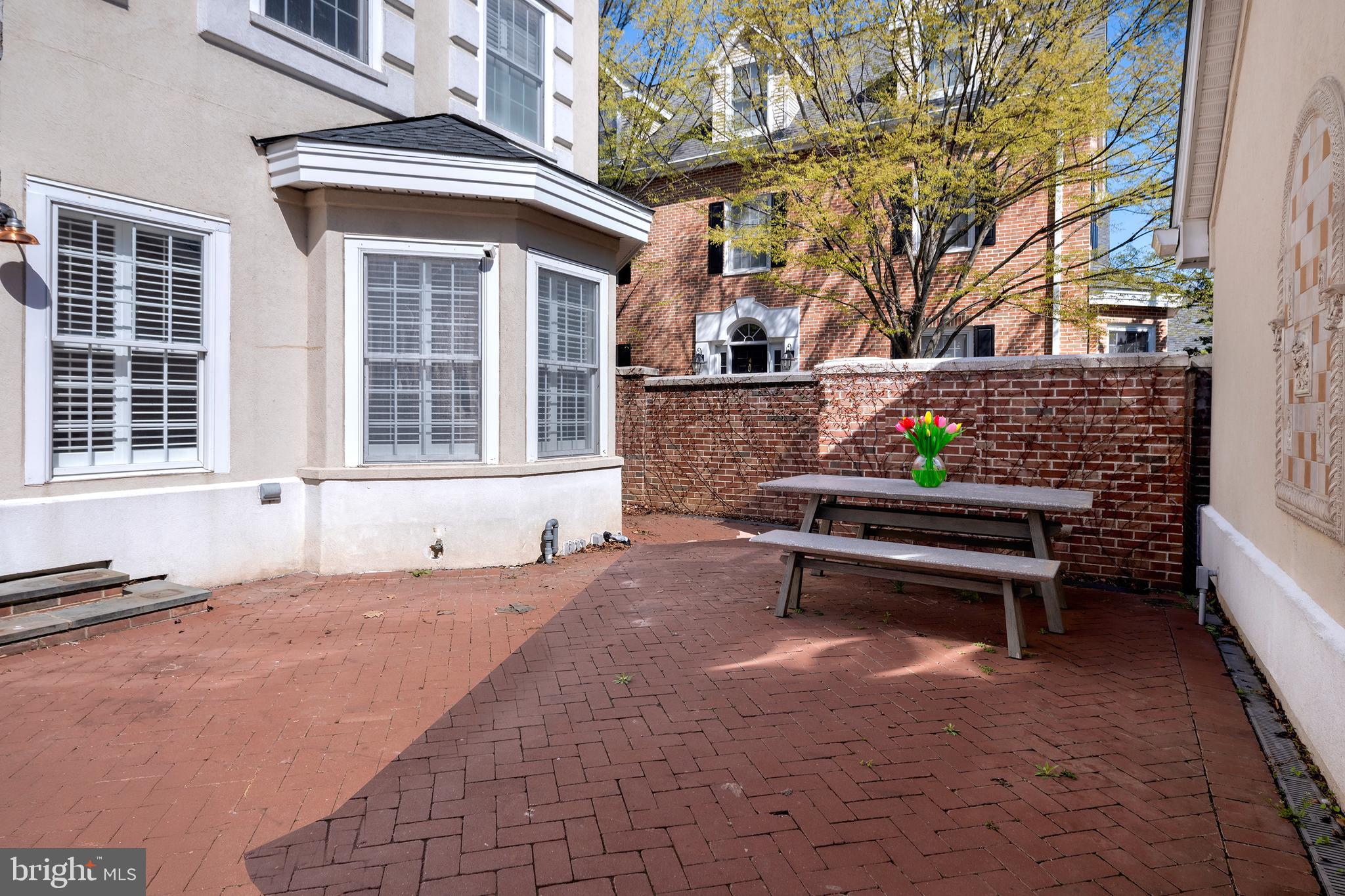 3 Governors Lane Princeton, NJ 08540 - Photo 25 of 26 a wooden bench sitting in front of a building