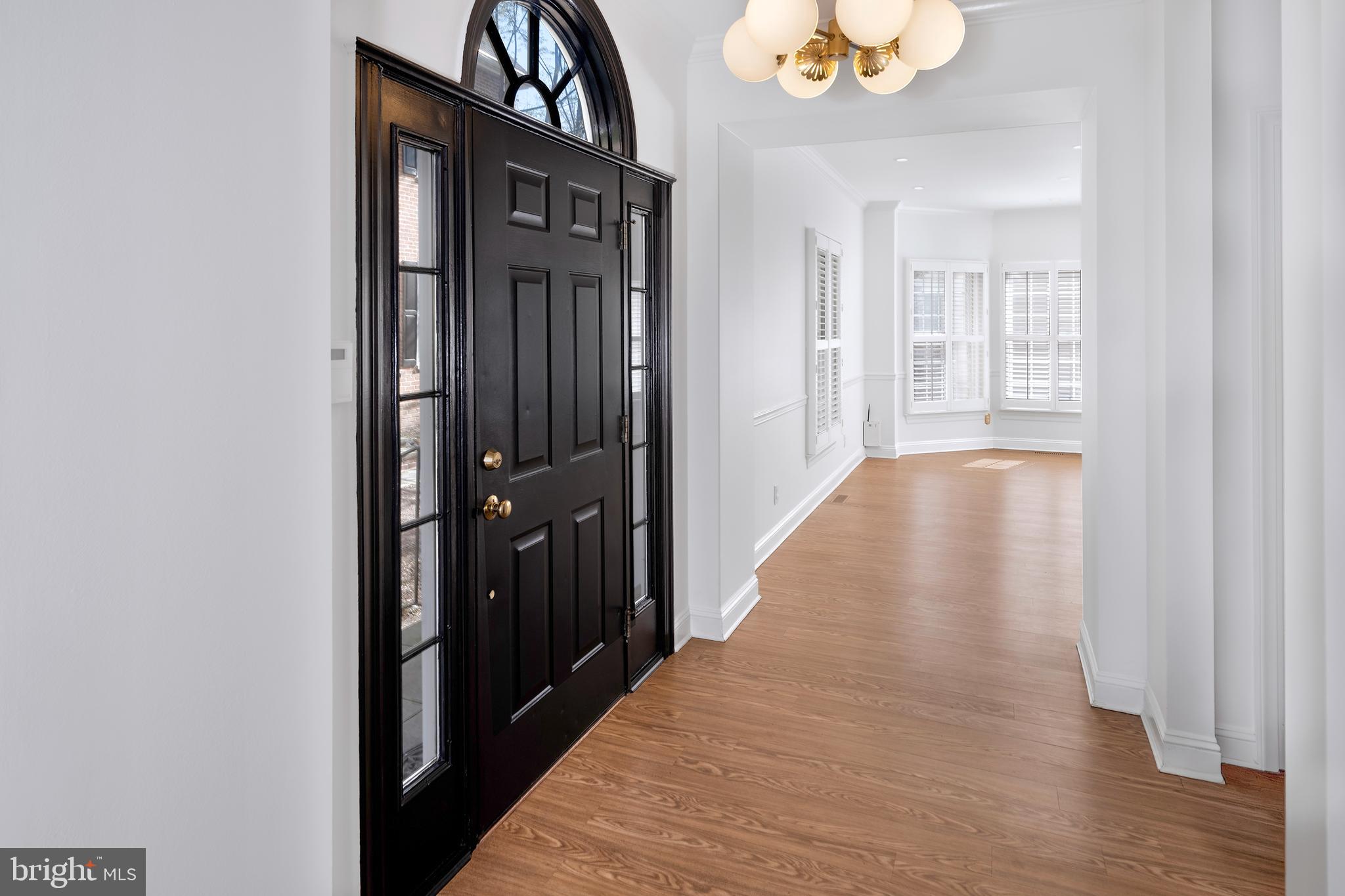 3 Governors Lane Princeton, NJ 08540 - Photo 3 of 26 a view of a hallway with wooden floor and a bathroom