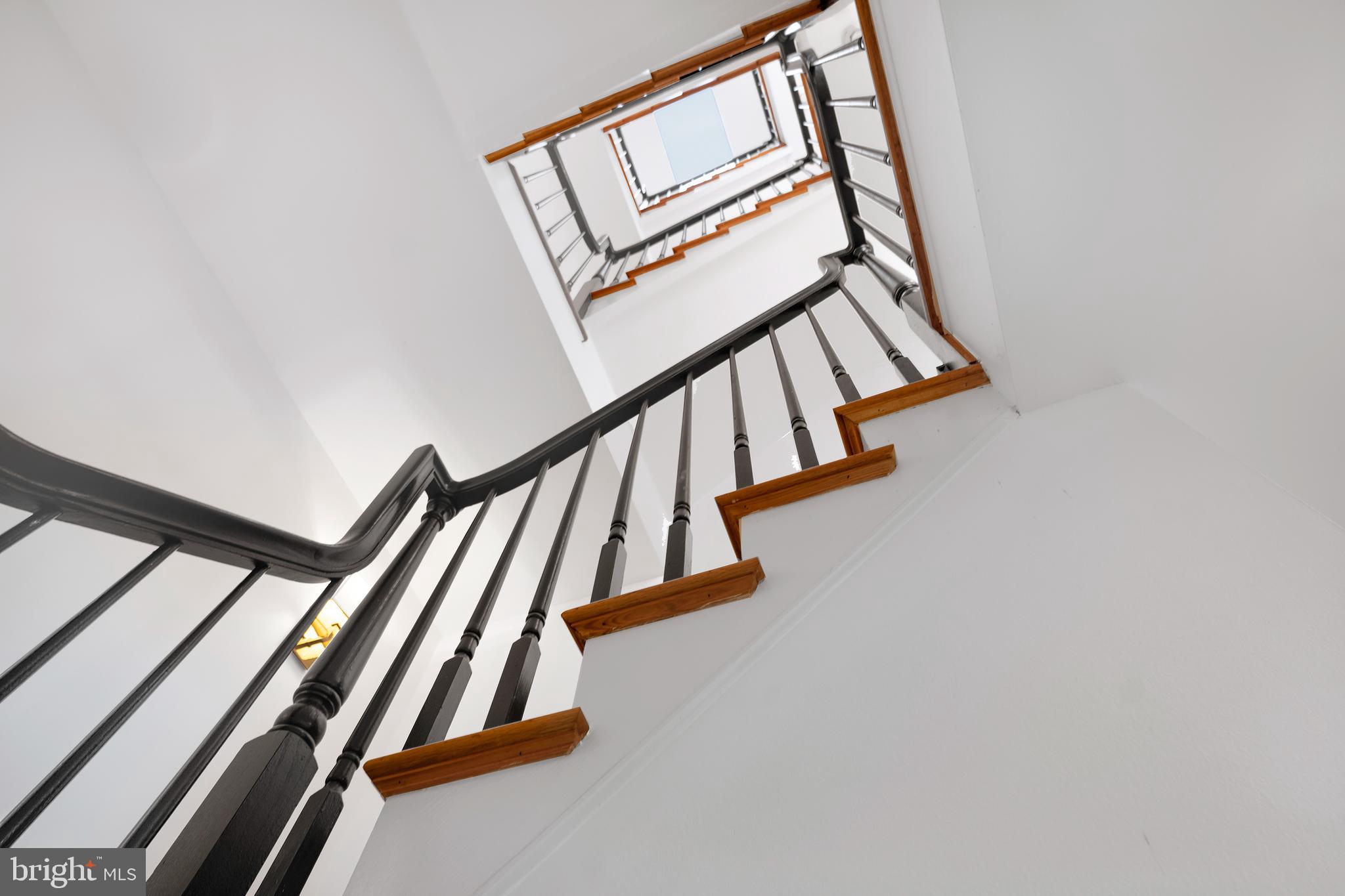 3 Governors Lane Princeton, NJ 08540 - Photo 4 of 26 a view of staircase with wooden floor and white walls