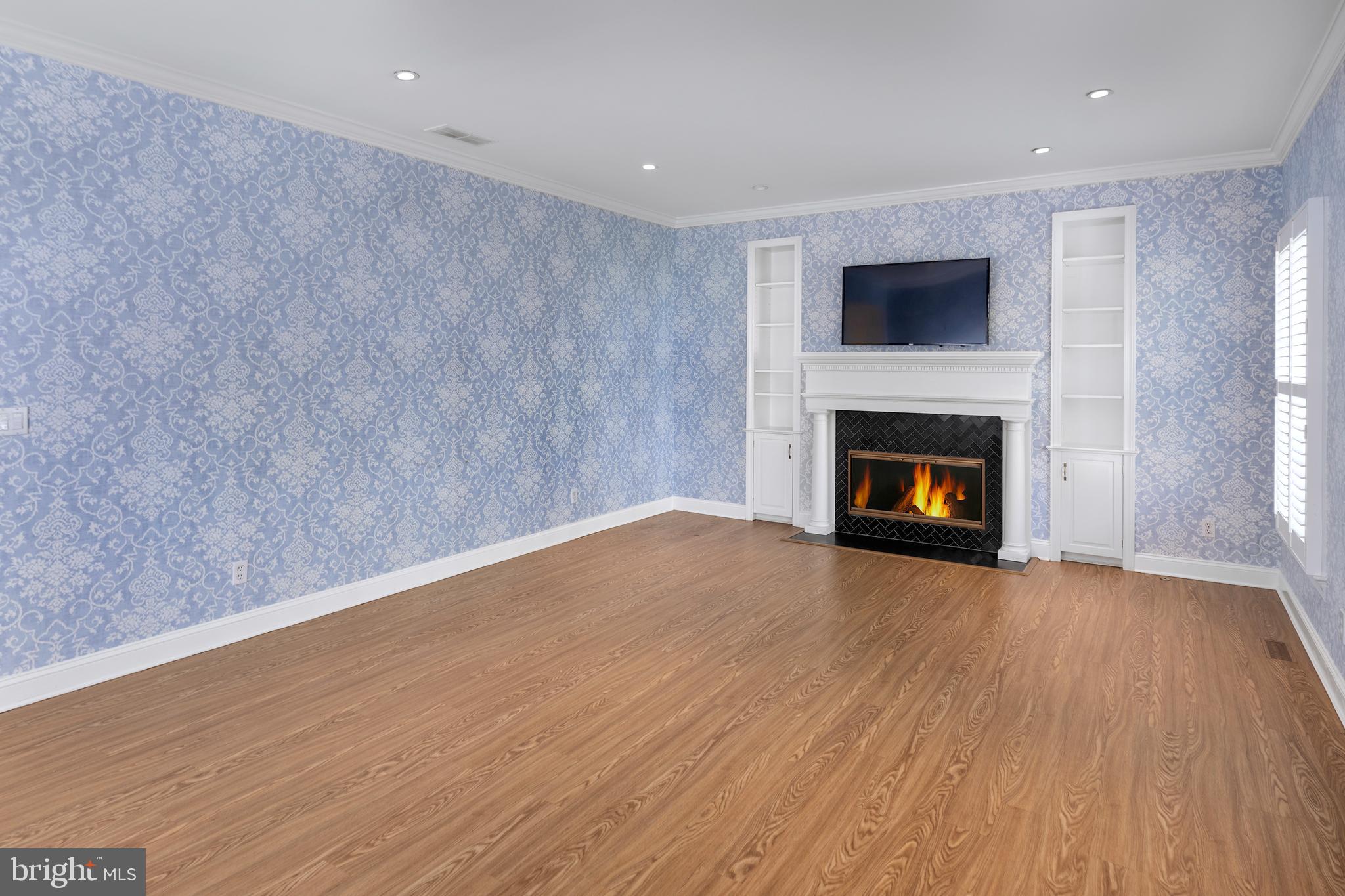 3 Governors Lane Princeton, NJ 08540 - Photo 9 of 26 a view of empty room with wooden floor and fireplace
