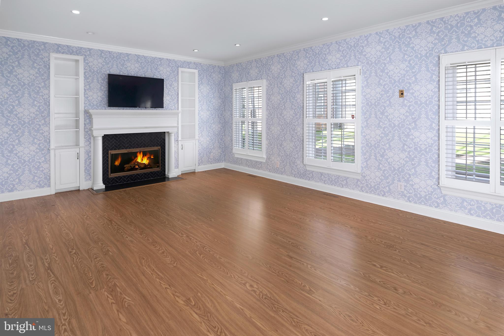 3 Governors Lane Princeton, NJ 08540 - Photo 10 of 26 a view of an empty room with wooden floor fireplace and a window