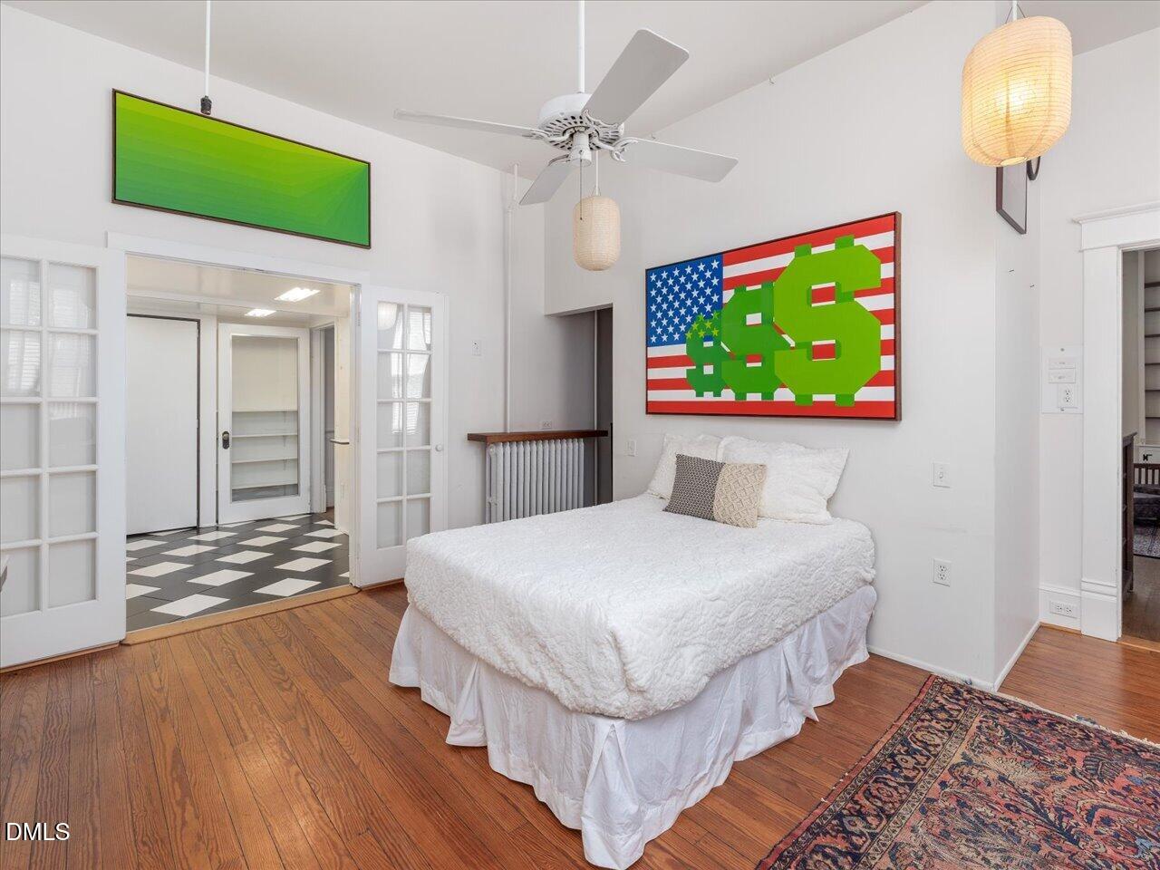215 Hillcrest Road Raleigh, NC 27605 - Photo 53 of 97 a bedroom with a bed and a flat screen tv