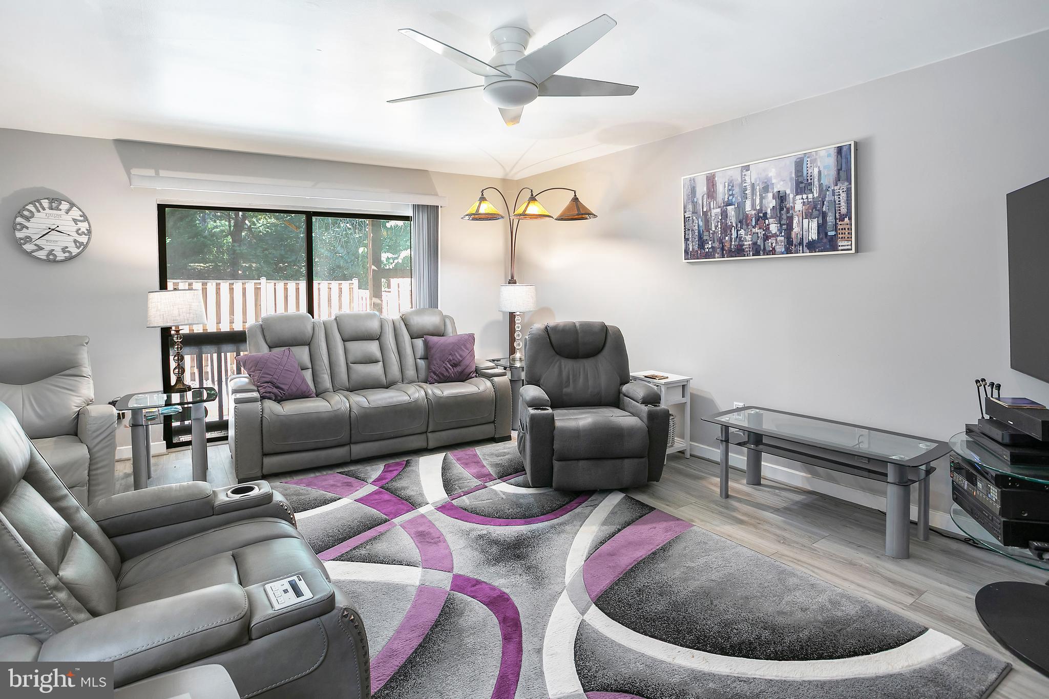 2213 Cedar Cove Court Reston, VA 20191 - Photo 2 of 40 a living room with furniture and a large window