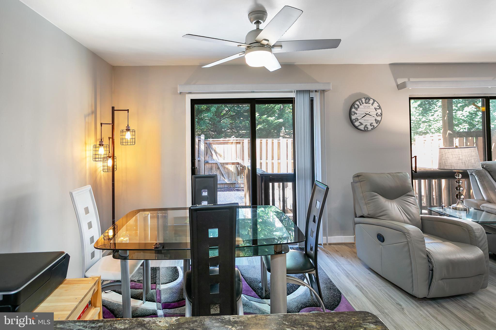2213 Cedar Cove Court Reston, VA 20191 - Photo 5 of 40 a living room with furniture a table and a large window