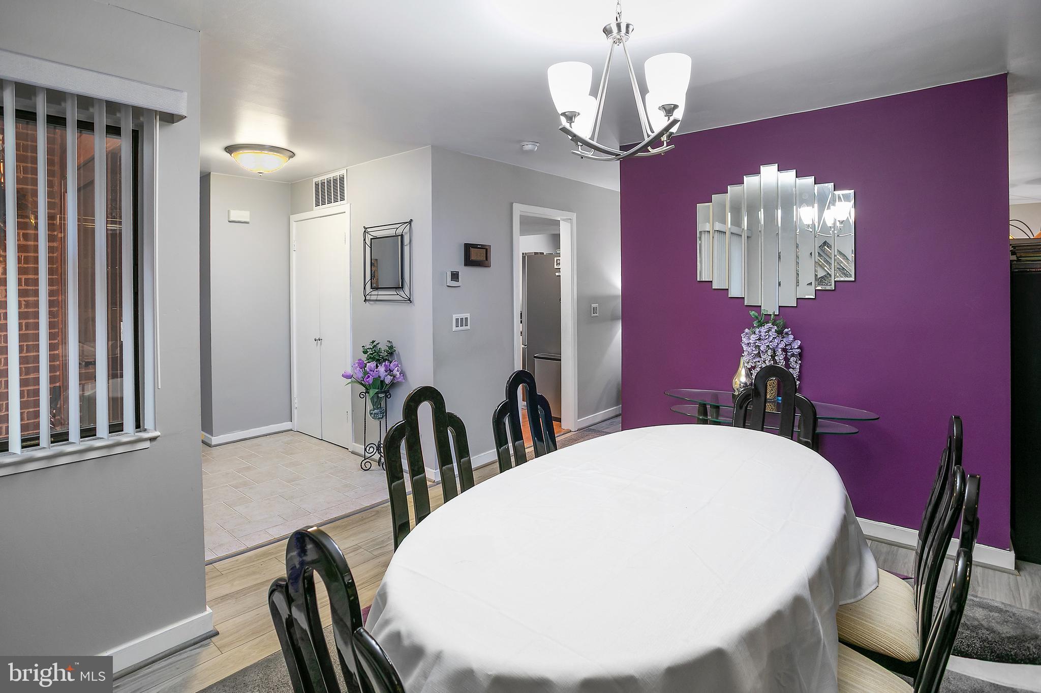 2213 Cedar Cove Court Reston, VA 20191 - Photo 6 of 40 a view of a dining room with furniture and chandelier