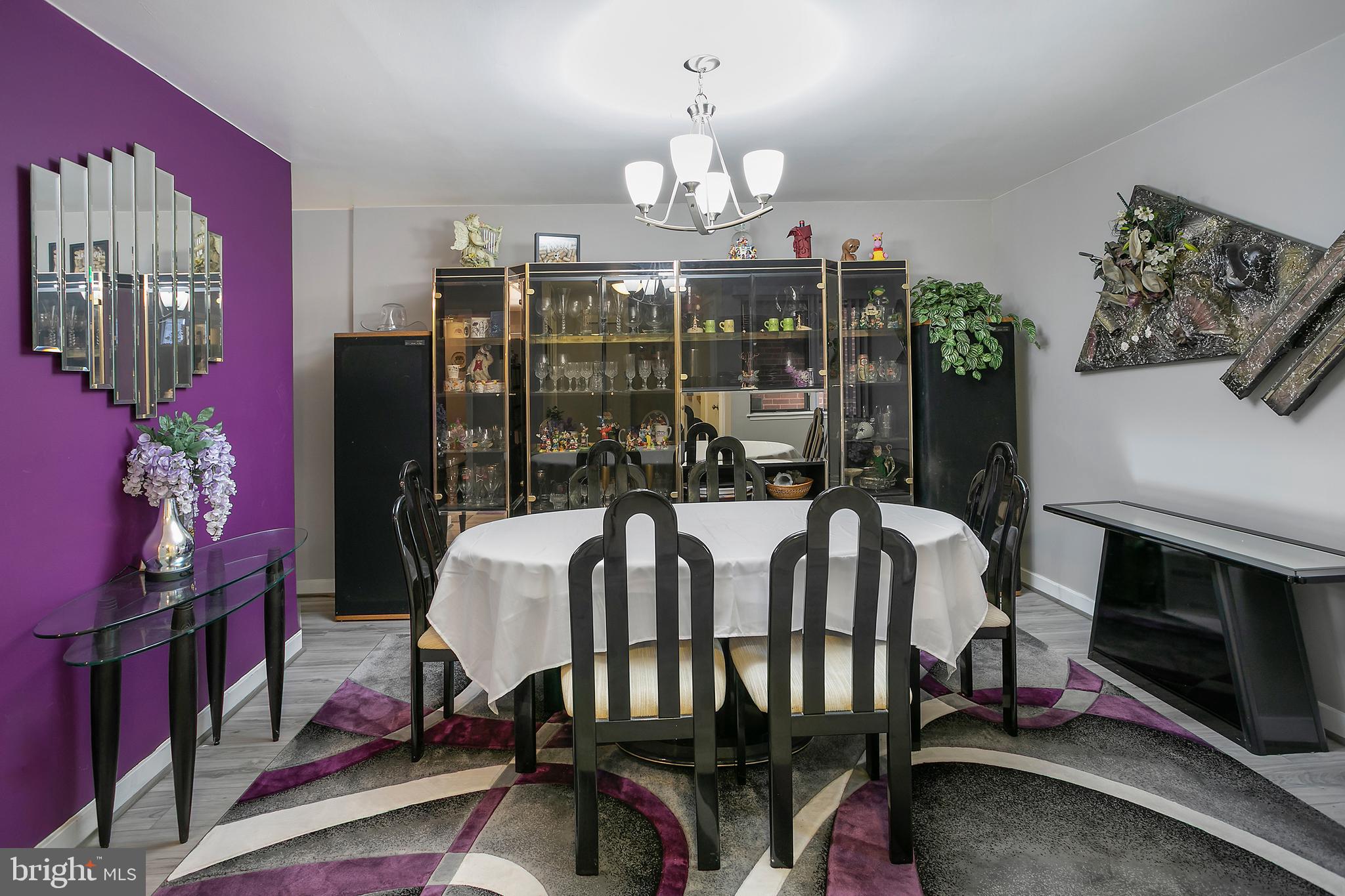 2213 Cedar Cove Court Reston, VA 20191 - Photo 7 of 40 a view of a dining room with furniture a chandelier and wooden floor