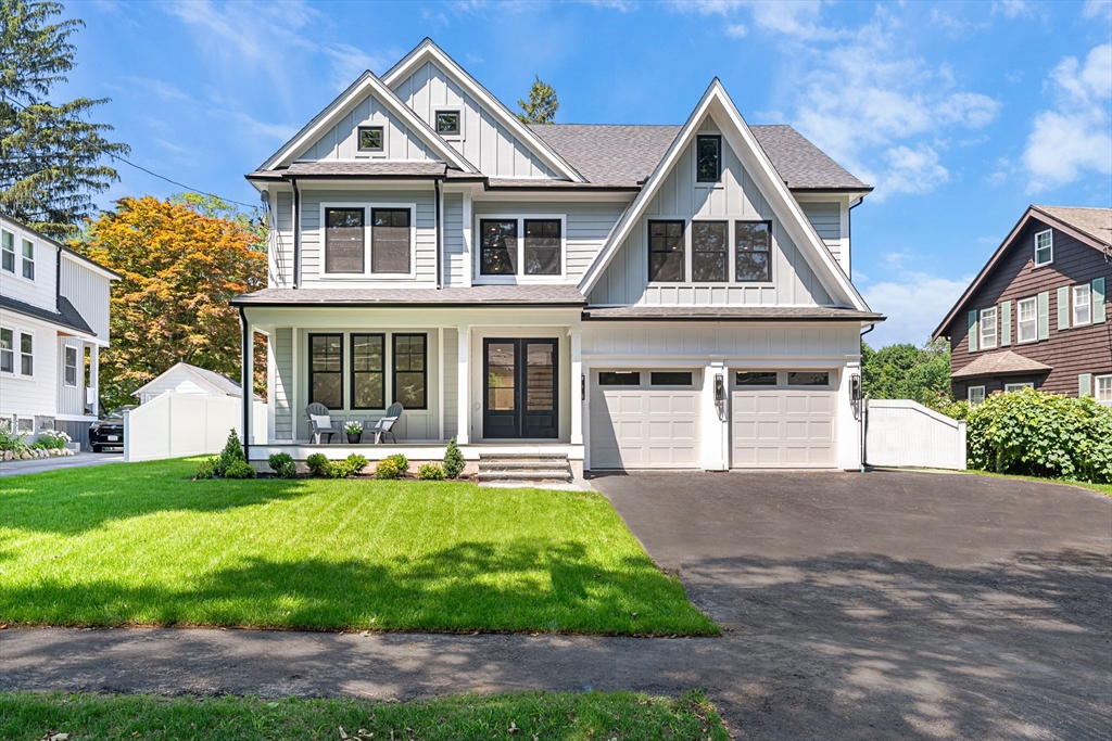 59 Henderson Street Needham, MA 02492 - Photo 1 of 32 a front view of a house with a yard