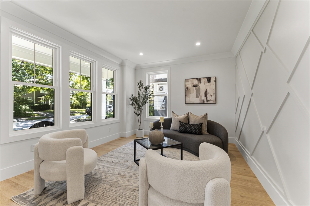 59 Henderson Street Needham, MA 02492 - Photo 13 of 32 a living room with furniture and a large window