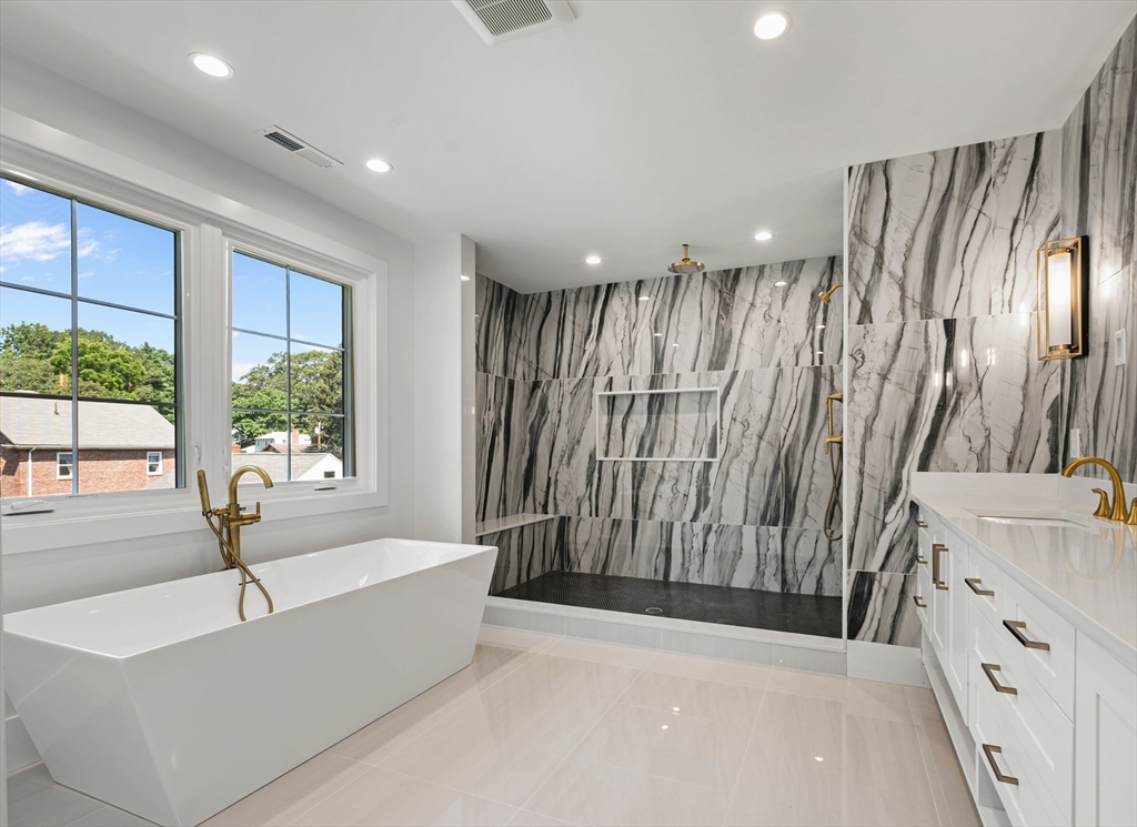 59 Henderson Street Needham, MA 02492 - Photo 17 of 32 a bathroom with a bathtub and shower