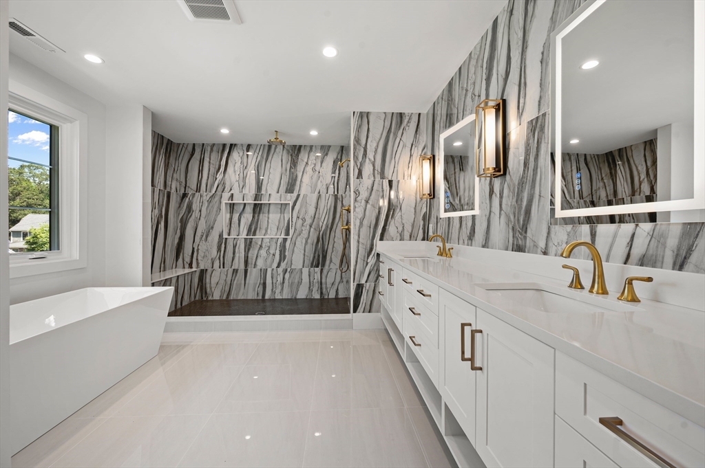 59 Henderson Street Needham, MA 02492 - Photo 18 of 32 a bathroom with double vanity and a shower