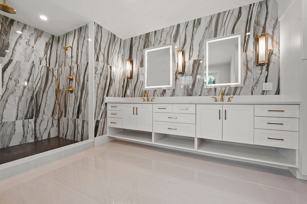 59 Henderson Street Needham, MA 02492 - Photo 20 of 32 a spacious bathroom with a double vanity sink and a mirror