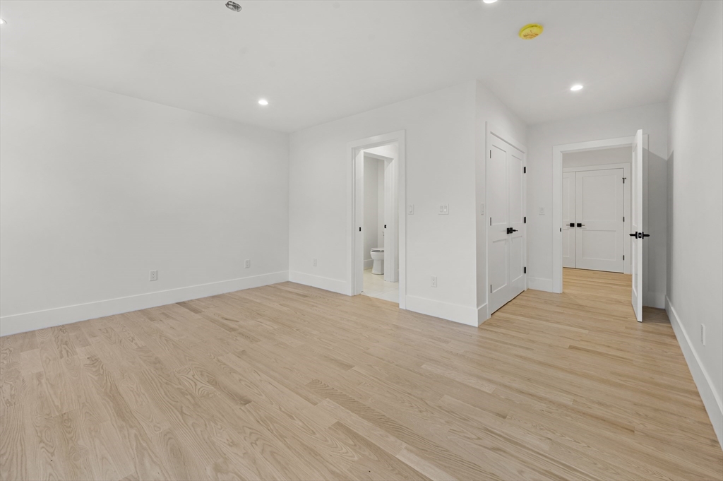 59 Henderson Street Needham, MA 02492 - Photo 23 of 32 a view of an empty room with wooden floor