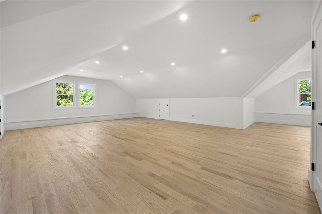 59 Henderson Street Needham, MA 02492 - Photo 25 of 32 an empty room with windows and wooden floor