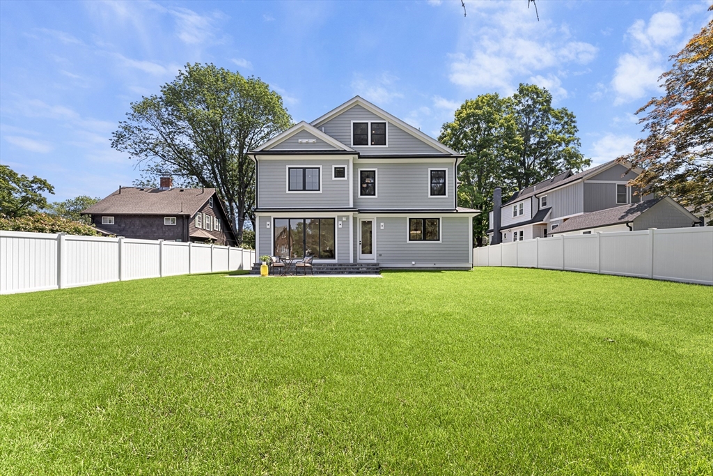 59 Henderson Street Needham, MA 02492 - Photo 28 of 32 a front of a house with a yard