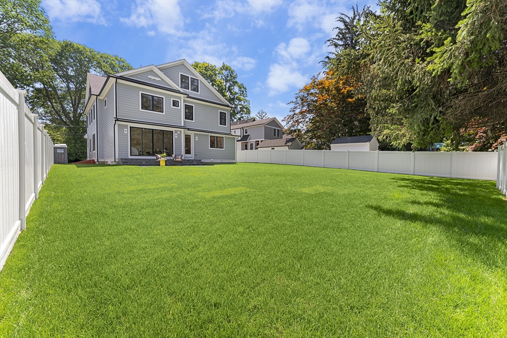 59 Henderson Street Needham, MA 02492 - Photo 29 of 32 a front view of house with yard and trees