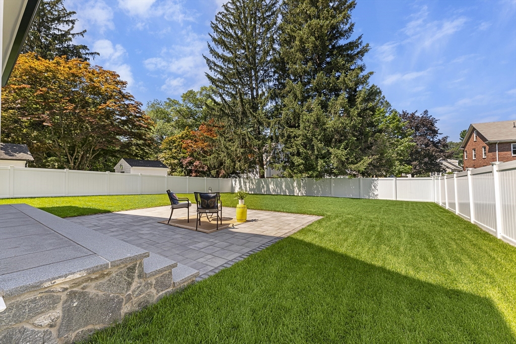 59 Henderson Street Needham, MA 02492 - Photo 30 of 32 a view of a swimming pool with an outdoor space and seating area