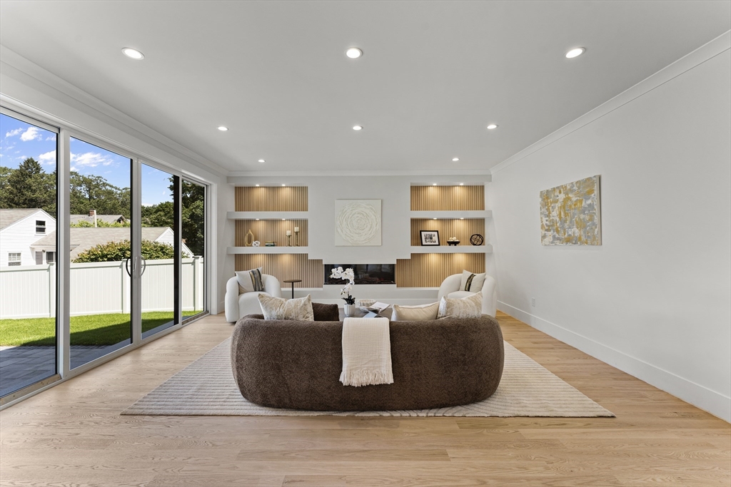59 Henderson Street Needham, MA 02492 - Photo 3 of 32 a living room with furniture large window and wooden floor