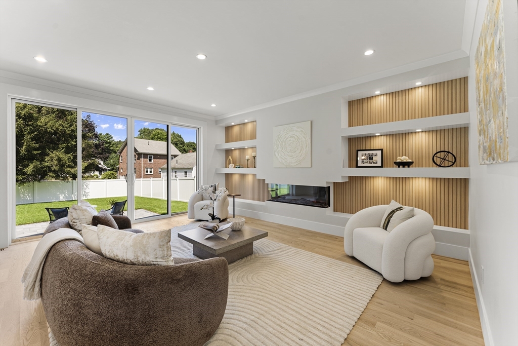 59 Henderson Street Needham, MA 02492 - Photo 4 of 32 a living room with furniture and a floor to ceiling window