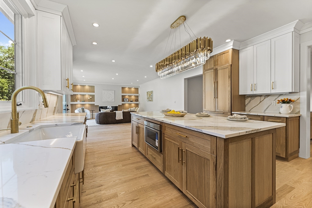 59 Henderson Street Needham, MA 02492 - Photo 7 of 32 a kitchen with a sink and stove