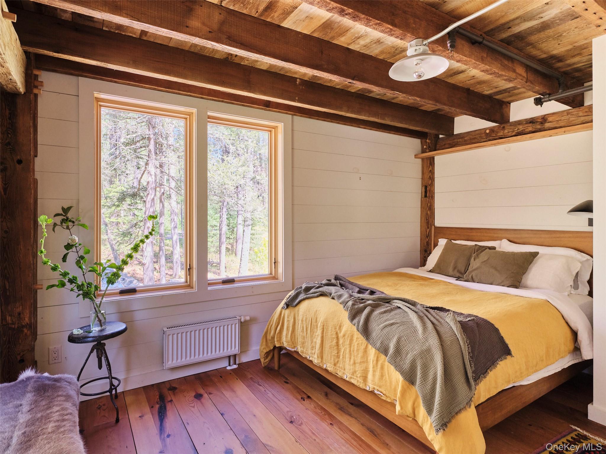 55 Woods Road Barryville, NY 12719 - Photo 35 of 50 a bed sitting in a bedroom next to a window