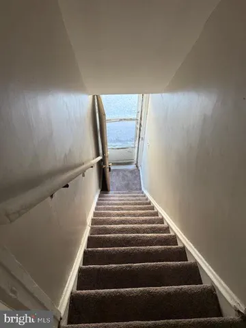 a view of a hallway with a livingroom