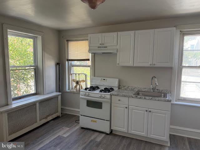 813 Arch Street Norristown, PA 19401 - Photo 14 of 18 a kitchen with appliances cabinets and a window