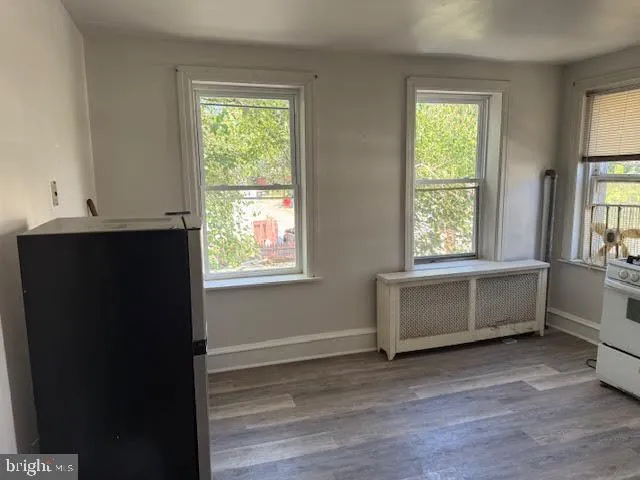 a living room with furniture a air conditioner and a window
