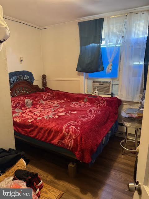 813 Arch Street Norristown, PA 19401 - Photo 6 of 18 a bed sitting in a bedroom next to a lamp