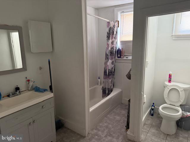 813 Arch Street Norristown, PA 19401 - Photo 7 of 18 a bathroom with a granite countertop toilet a sink and a bathtub