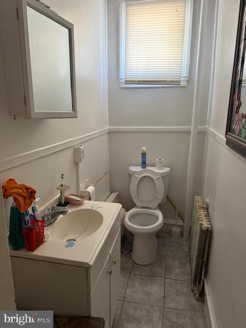 813 Arch Street Norristown, PA 19401 - Photo 8 of 18 a bathroom with a sink mirror and toilet