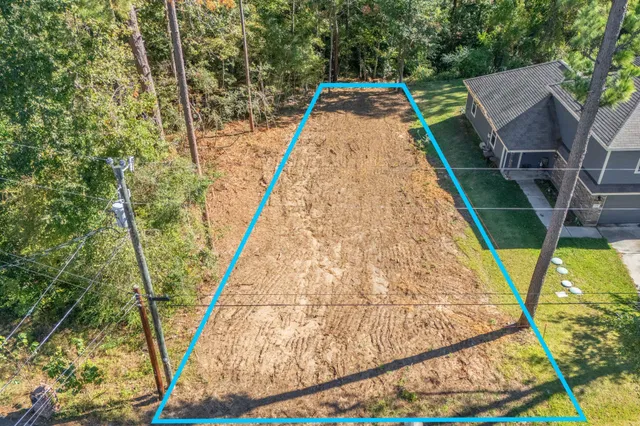 a view of a yard with trees