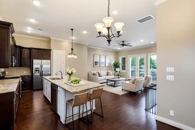 a large kitchen with a table and chairs
